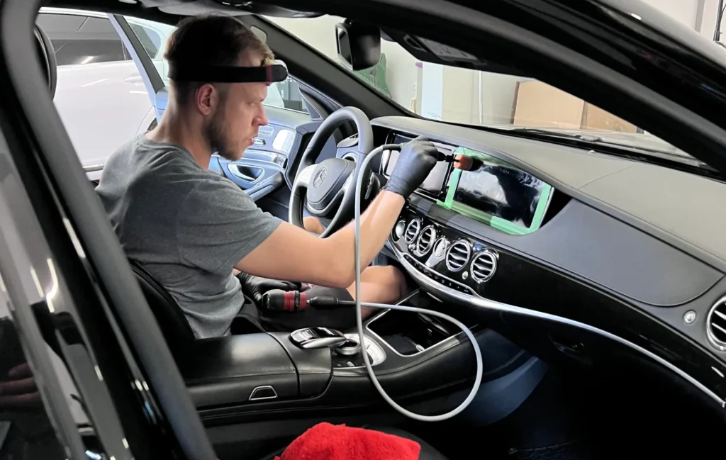 profesional detailer polishing interior lcd screen