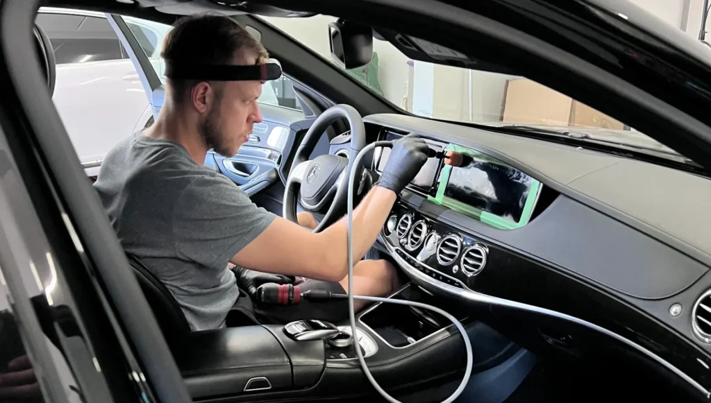 profesional detailer polishing interior lcd screen